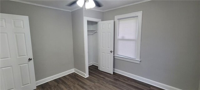 5118 Wabash Ave, Kansas City, MO 64130 - unfurnished bedroom with dark wood-type flooring, baseboards, ornamental molding, a closet, and a ceiling fan