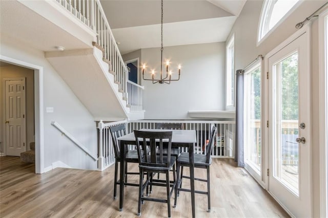 5309 NE Rainbow Cir, Lees Summit, MO 64064 - dining room featuring wood finished floors and a chandelier