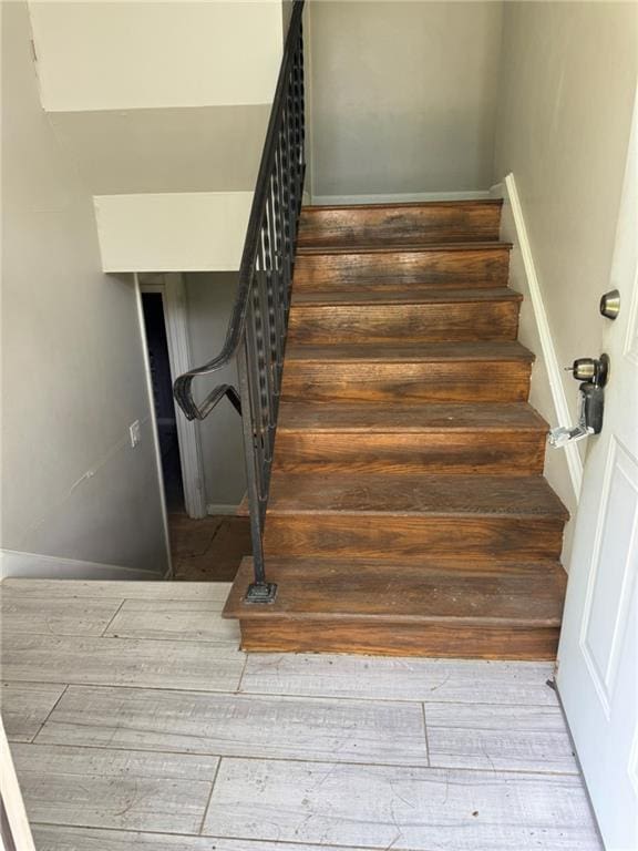 3006 S Santa Fe Rd, Independence, MO 64055 - stairs featuring hardwood / wood-style floors
