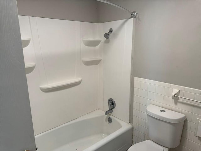 3006 S Santa Fe Rd, Independence, MO 64055 - full bathroom with toilet, bathing tub / shower combination, tile walls, and wainscoting