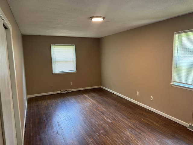 3006 S Santa Fe Rd, Independence, MO 64055 - unfurnished room with dark wood-style floors and baseboards