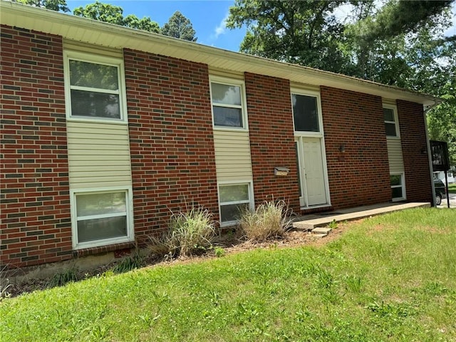 3006 S Santa Fe Rd, Independence, MO 64055 - view of front of house with a front yard and brick siding