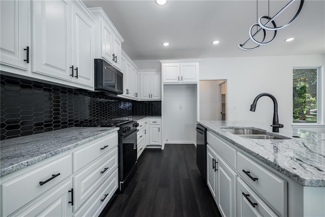 11147 Rowland Ave, Kansas City, KS 66109 - kitchen featuring black appliances, a sink, white cabinets, dark wood finished floors, and recessed lighting