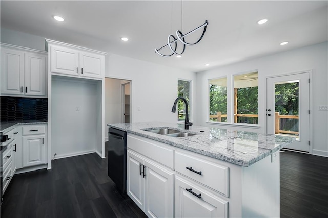 11147 Rowland Ave, Kansas City, KS 66109 - kitchen featuring a sink, black dishwasher, dark wood-style floors, recessed lighting, and light stone countertops