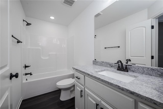 11147 Rowland Ave, Kansas City, KS 66109 - full bath with wood finished floors, vanity, toilet,  shower combination, and recessed lighting