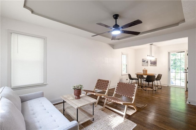 1617 N Pearl St, Independence, MO 64050 - living room featuring wood finished floors, ceiling fan, and a tray ceiling