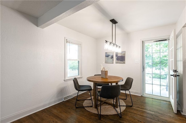 1617 N Pearl St, Independence, MO 64050 - dining space featuring dark wood-style flooring and a textured wall