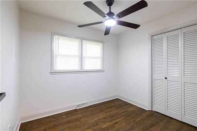 1617 N Pearl St, Independence, MO 64050 - unfurnished bedroom featuring a closet, dark wood-type flooring, and a ceiling fan