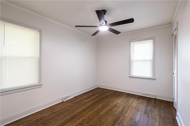 1617 N Pearl St, Independence, MO 64050 - spare room featuring dark wood finished floors, a ceiling fan, and ornamental molding