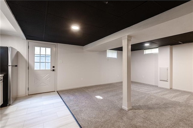 1617 N Pearl St, Independence, MO 64050 - below grade area featuring freestanding refrigerator, light carpet, and recessed lighting