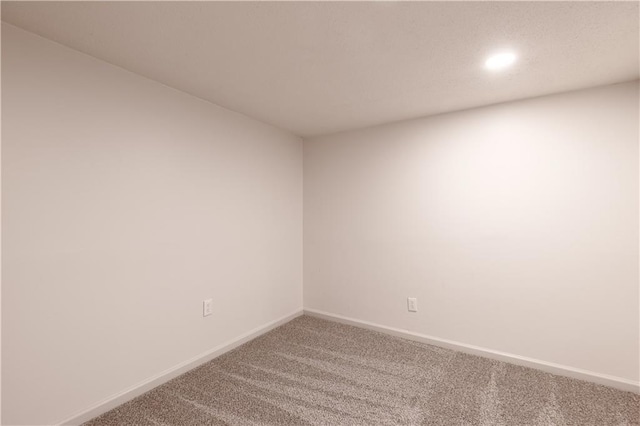 1617 N Pearl St, Independence, MO 64050 - carpeted empty room with baseboards and recessed lighting