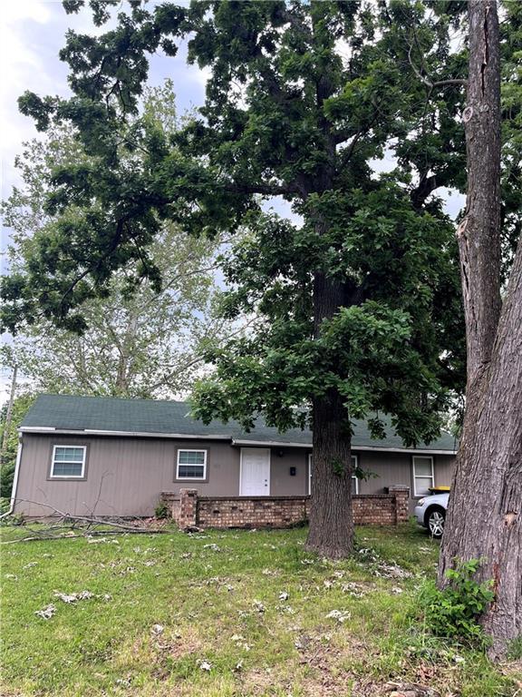 11003 Bristol Ter, Kansas City, MO 64134 - view of front facade with a front yard