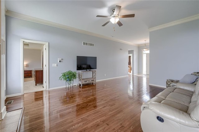 8905 NE 101st St, Kansas City, MO 64157 - living area featuring crown molding, a ceiling fan, wood finished floors, and baseboards