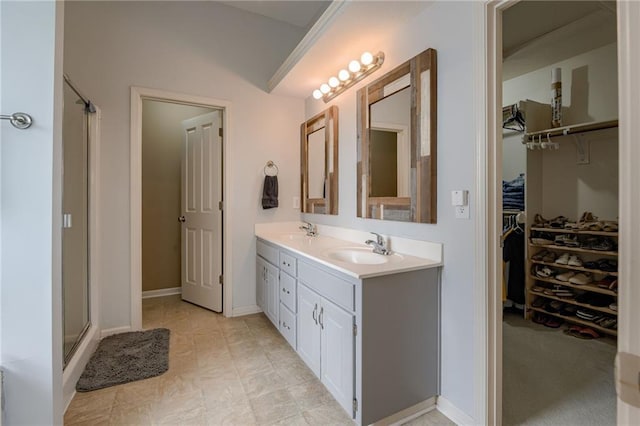 8905 NE 101st St, Kansas City, MO 64157 - full bathroom with double vanity, a stall shower, and a walk in closet