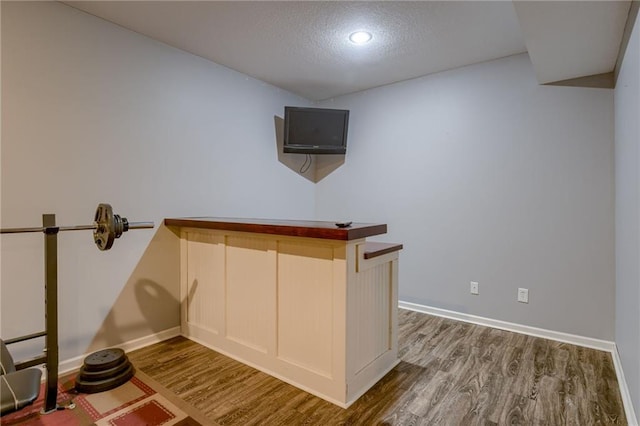 8905 NE 101st St, Kansas City, MO 64157 - bar area featuring dark wood-style floors, baseboards, a textured ceiling, and recessed lighting