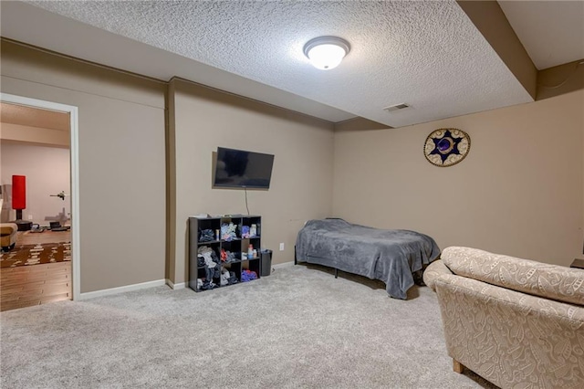8905 NE 101st St, Kansas City, MO 64157 - carpeted bedroom featuring a textured ceiling and baseboards