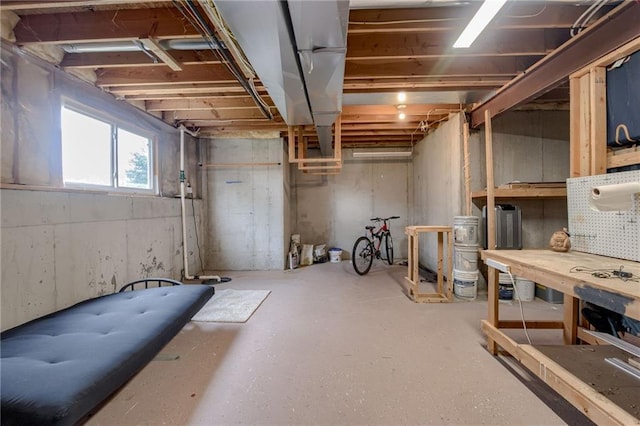 8905 NE 101st St, Kansas City, MO 64157 - basement with a workshop area