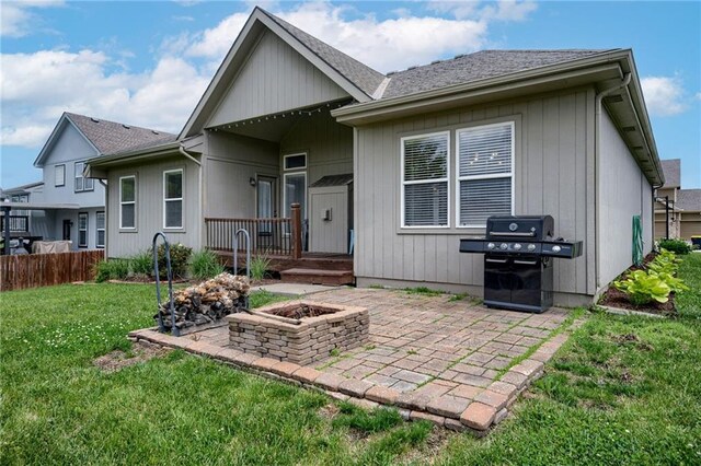 8905 NE 101st St, Kansas City, MO 64157 - rear view of house with a patio area, a fire pit, and roof with shingles