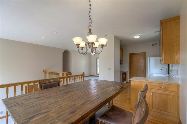 833 SW Harvest Dr, Grain Valley, MO 64029 - dining space with a chandelier, recessed lighting, and light wood-style floors