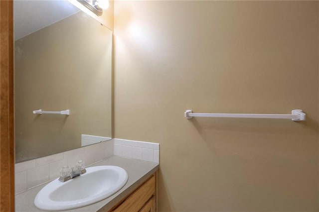 833 SW Harvest Dr, Grain Valley, MO 64029 - bathroom with vanity and decorative backsplash