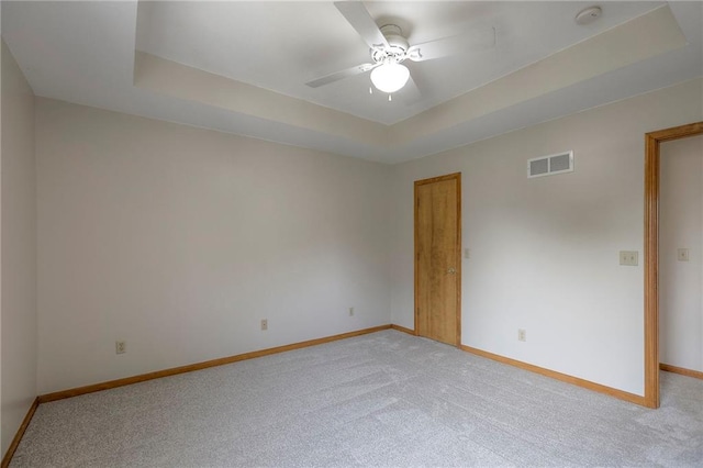 833 SW Harvest Dr, Grain Valley, MO 64029 - spare room featuring light carpet, baseboards, a ceiling fan, a raised ceiling, and a smoke detector