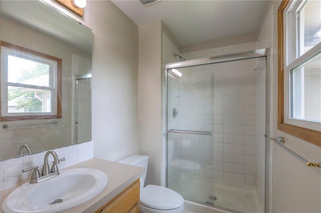 833 SW Harvest Dr, Grain Valley, MO 64029 - bathroom with toilet, a stall shower, and vanity