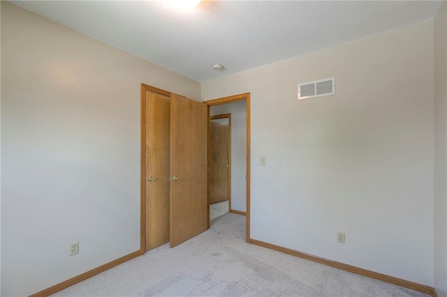 833 SW Harvest Dr, Grain Valley, MO 64029 - unfurnished bedroom featuring light colored carpet, baseboards, and a closet