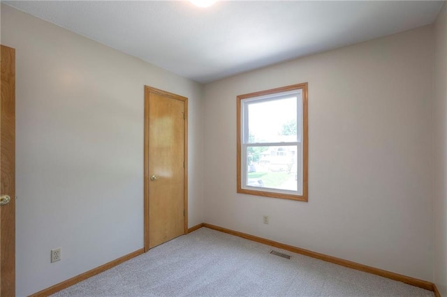 833 SW Harvest Dr, Grain Valley, MO 64029 - carpeted spare room with baseboards