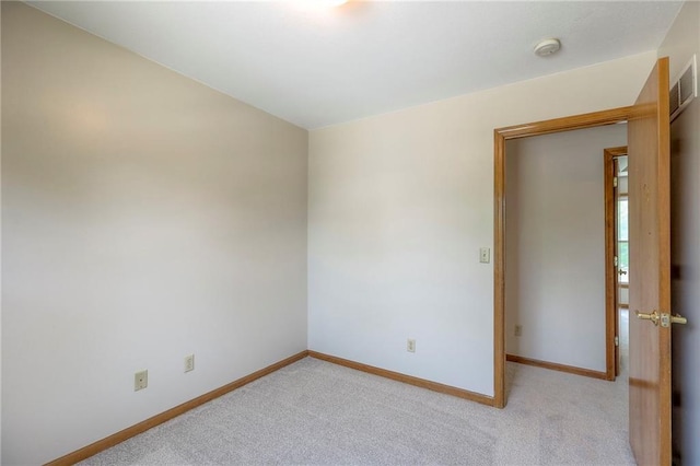 833 SW Harvest Dr, Grain Valley, MO 64029 - unfurnished room with baseboards, light colored carpet, and a smoke detector