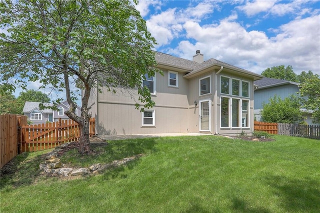 833 SW Harvest Dr, Grain Valley, MO 64029 - rear view of property featuring a chimney and roof with shingles