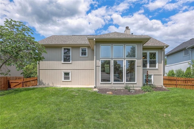 833 SW Harvest Dr, Grain Valley, MO 64029 - rear view of property with a chimney and roof with shingles