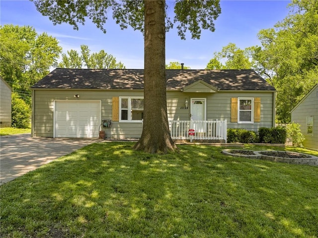 11124 W 69th Ter, Shawnee, KS 66203 - view of front facade featuring a garage, driveway, and a front lawn