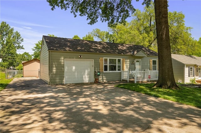 11124 W 69th Ter, Shawnee, KS 66203 - view of front of house featuring driveway and a garage