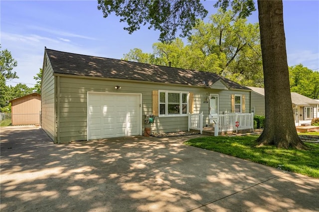 11124 W 69th Ter, Shawnee, KS 66203 - view of front facade with driveway and a garage