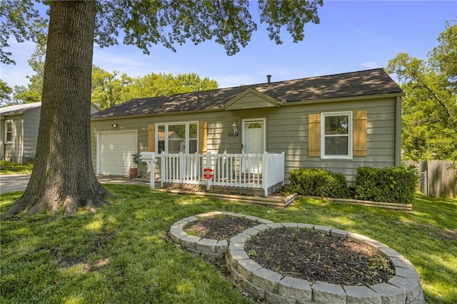 11124 W 69th Ter, Shawnee, KS 66203 - view of front of home featuring a garage and a front lawn