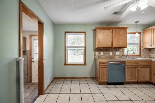 11124 W 69th Ter, Shawnee, KS 66203 - kitchen featuring stainless steel dishwasher, a sink, decorative backsplash, a ceiling fan, and decorative light fixtures