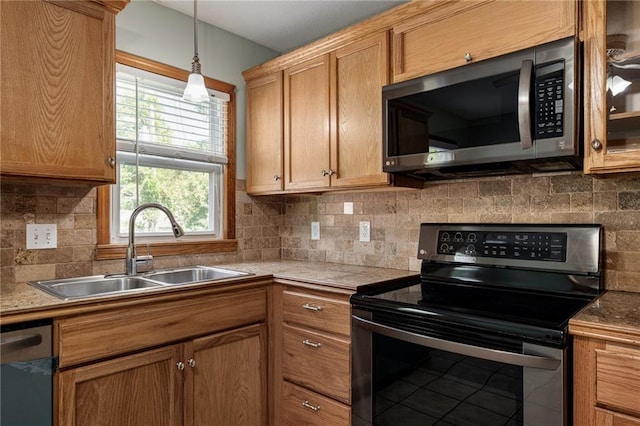 11124 W 69th Ter, Shawnee, KS 66203 - kitchen with stainless steel appliances, a sink, decorative backsplash, and decorative light fixtures