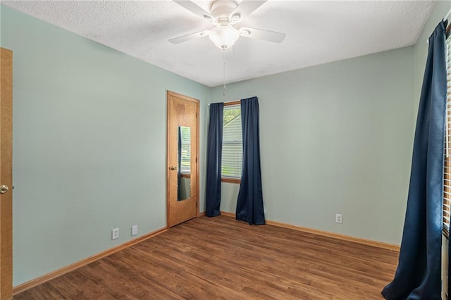11124 W 69th Ter, Shawnee, KS 66203 - empty room with wood finished floors, baseboards, a ceiling fan, and a textured ceiling