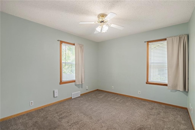 11124 W 69th Ter, Shawnee, KS 66203 - unfurnished room with carpet, ceiling fan, baseboards, and a textured ceiling