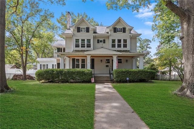 424 S Elm St, Ottawa, KS 66067 - shingle-style home featuring a chimney and a porch