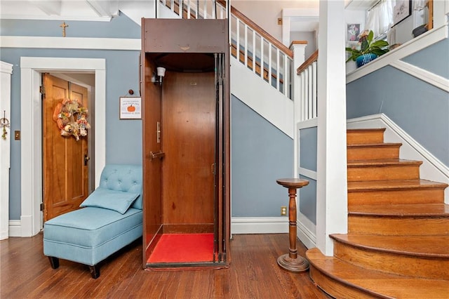 424 S Elm St, Ottawa, KS 66067 - stairway with wood finished floors and baseboards