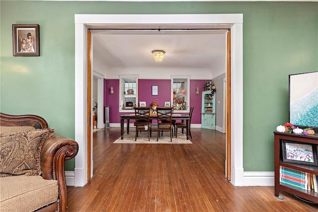 424 S Elm St, Ottawa, KS 66067 - dining space with dark wood-style flooring and baseboards
