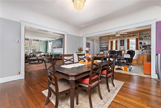 424 S Elm St, Ottawa, KS 66067 - dining area featuring wood finished floors, ceiling fan, and baseboards