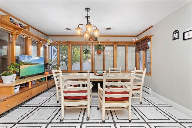 424 S Elm St, Ottawa, KS 66067 - sunroom featuring a baseboard radiator and a chandelier