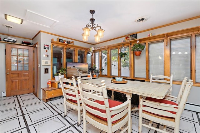 424 S Elm St, Ottawa, KS 66067 - dining room featuring ornamental molding, a baseboard radiator, and a chandelier