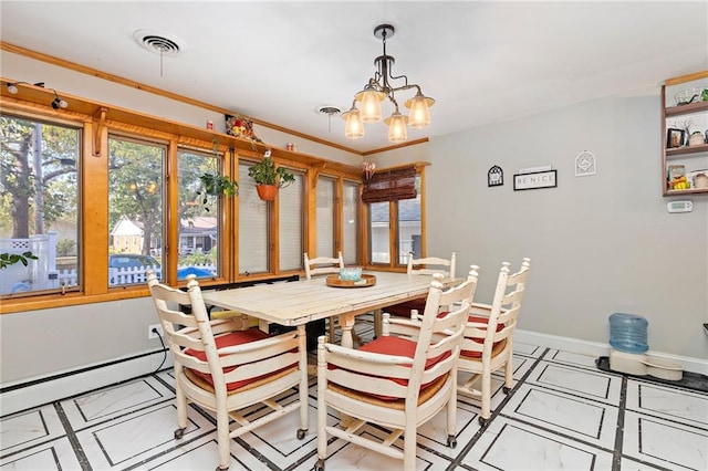 424 S Elm St, Ottawa, KS 66067 - dining space featuring a chandelier, baseboards, and baseboard heating