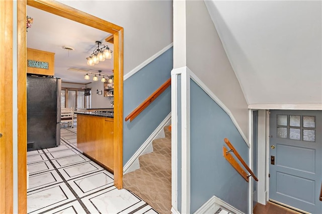 424 S Elm St, Ottawa, KS 66067 - foyer featuring baseboards and stairs