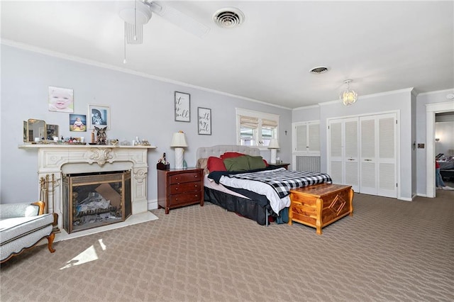 424 S Elm St, Ottawa, KS 66067 - carpeted bedroom featuring ornamental molding, a fireplace, baseboards, and ceiling fan