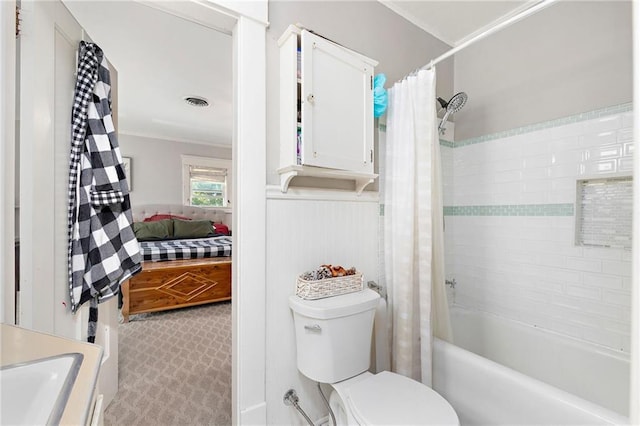 424 S Elm St, Ottawa, KS 66067 - ensuite bathroom with shower / bath combo with shower curtain, toilet, vanity, and ornamental molding
