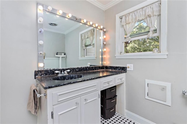 424 S Elm St, Ottawa, KS 66067 - bathroom with vanity, crown molding, and baseboards
